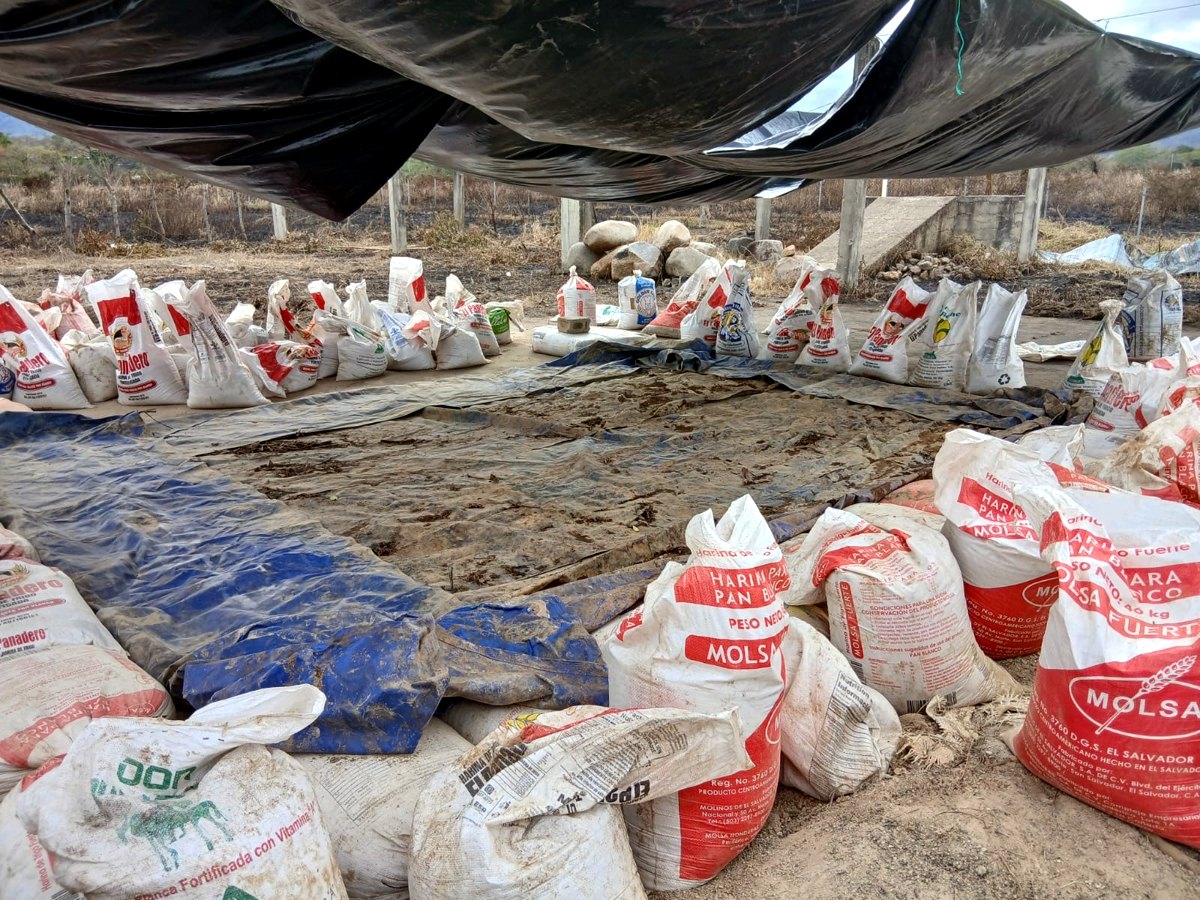 Covered yard with bagged antimony ore stockpiled